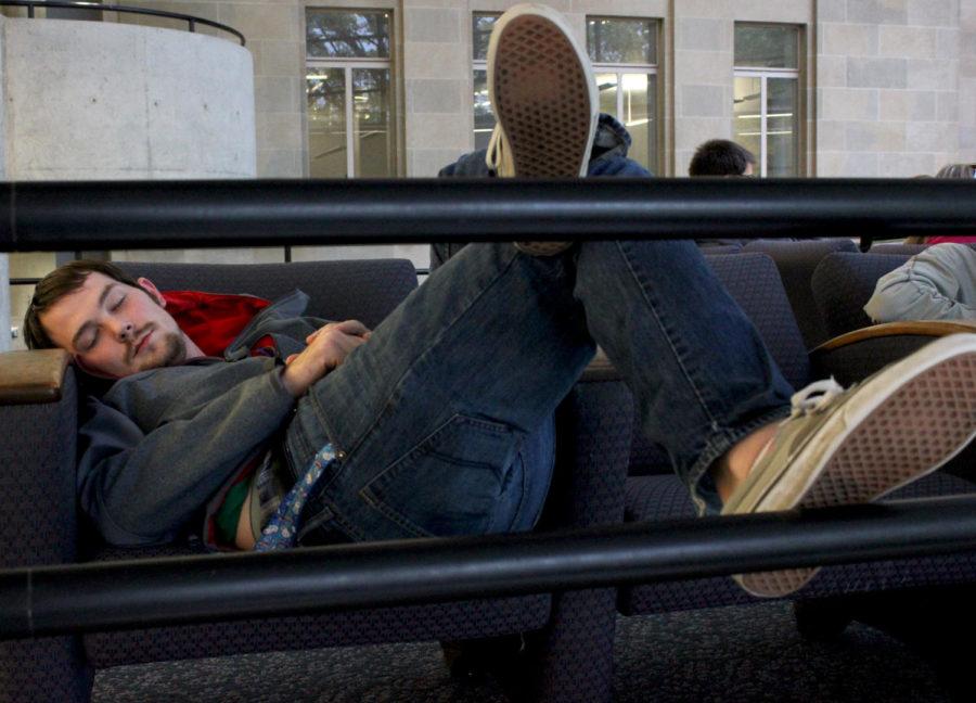 A student sleeps at Parks Library on campus.