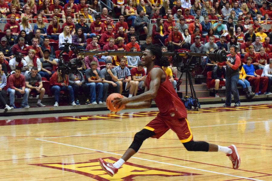 Redshirt junior forward Jameel McKay goes up for a dunk during the dunk contest during Hilton Madness on Oct. 18.