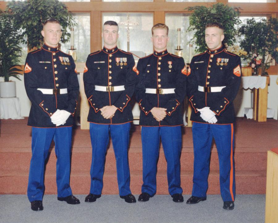 Soccer coach Tony Minatta, far right, stands with his members of his unit from when he was in the Marines. 