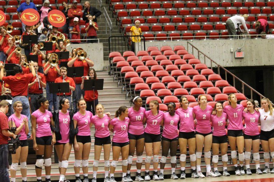 On+Oct.+4%2C+the+volleyball+team+stood+next+to+the+pep+band+and+swayed+along+to+The+Bells+of+Iowa+State.+Each+player+wore+a+pink+jersey+to+think+pink+and+raise+awareness+of+breast+cancer.%C2%A0