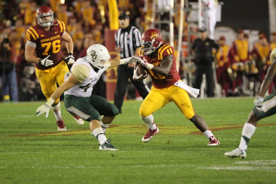 Senior tight end E.J. Bibbs runs after the reception. Bibbs has caught a pass in the past 16 consecutive games, which ties an ISU record. The Cyclones fell to the Bears with a final score of 49-28. 
