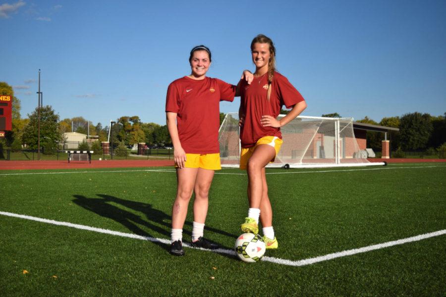 Stella Maris Strohman and Laura Friedrich finish up practice on Tuesday at the Iowa State Soccer Complex. Both Strohman and Friedrich are Ames natives, and joined the team this year.