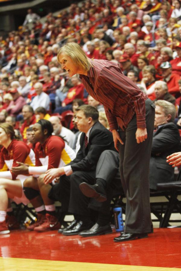 Asst. Head Coach Jodi Steyer yells direction to the team from the bench. The team faced up against the Kansas State Wildcats on Saturday night, ending with a final score of 84-65 in favor of the Cyclones. 