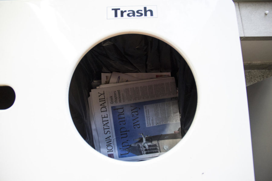 Copies of the Oct. 8 issue of the Iowa State Daily lie inside trash cans in the Gerdin Business Building after individuals removed entire stacks of papers from the newsstands and placed them in the trash.