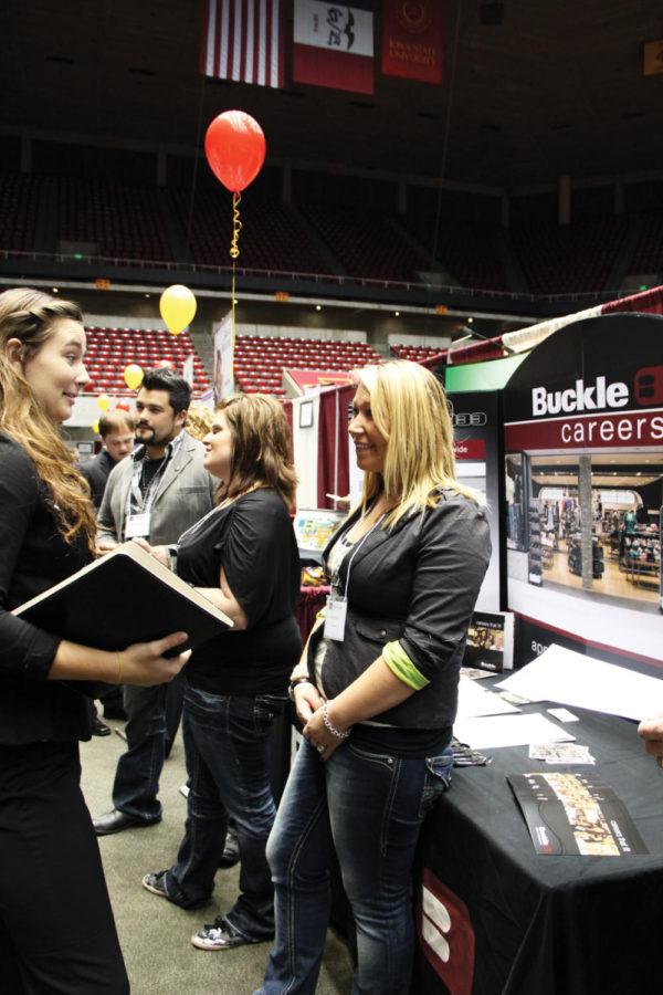 Anna Kurns, junior in management, talks with Amy Neal of Buckle
about the potential career opportunities at the Business, Liberal
Arts and Sciences, and Human Sciences Career Fair on Wednesday,
Sept. 28, at Hilton Coliseum. Buckle is a clothing store offering
multiple options for students regarding jobs. 
