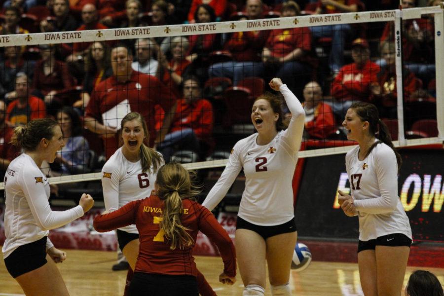 The ISU volleyball team celebrates winning a set during their game against Oklahoma on Oct. 12.