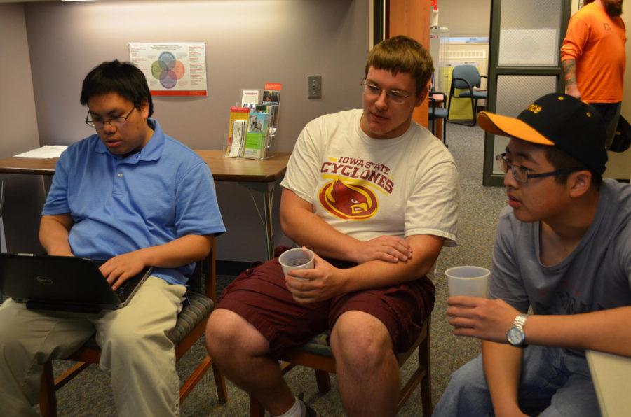 Tan NguyenCQ, senior in business economics and finance, Brandon KeeslingCQ, junior in industrial technology, and Vincent LinCQ, sophomore in political science and psychology, discussing Disability Awareness Week events. The open house was held at the Student Services building Oct. 13. 2014.