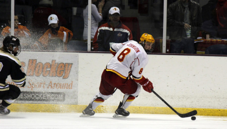 Freshman Zack Johnson, forward, grabs the puck during the hockey game against Lindenwood. Iowa State suffered a 3-2 defeat against Lindenwood on Oct. 17 at the ISU/Ames Ice Arena and another loss on Oct. 18 of 2-1 in overtime.