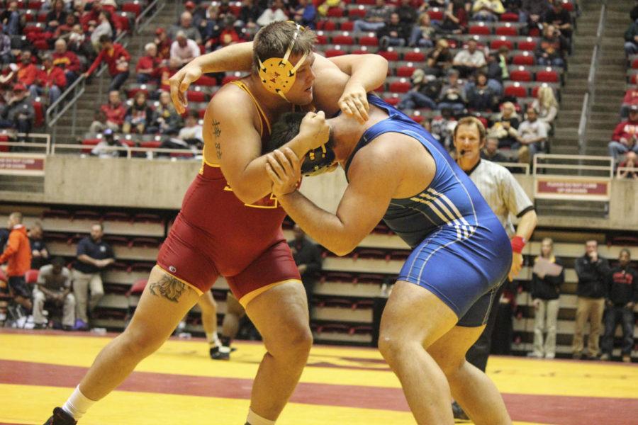 Wrestling at 285 pounds, redshirt junior Tyler Swope works to gain control of his University of Nebraska Kearney opponent Luke Petersen. Swope picked up a win in the first round of the Cyclone Open on Nov. 8 with a score of 5-4.