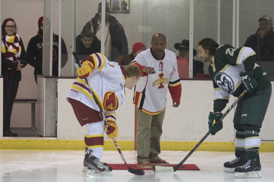 Jeff Johnson, president and CEO of the Iowa State University Alumni Association, drops the puck before the game. Iowa State defeated Colorado State 5-2 on Nov. 22.