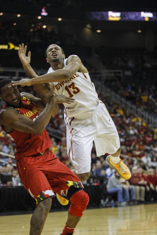 Senior guard Bryce Dejean-Jones falls over Marylands Dez Wells after being fouled during the CBE Hall of Fame Classic Championship on Nov. 25 at the Sprint Center in Kansas City, Mo. The Cyclones couldnt rally against the Terrapins and fell 72-63.