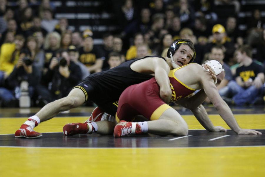 Redshirt sophomore Kyle Larson is taken down by Iowa’s Thomas Gilman. After allowing another takedown, Larson lost the 125-pound match 6-1 in the Cy-Hawk Series duel which took place Nov. 29 in Iowa City. The No. 15 Cyclones struggled to secure close matches, falling to rival No. 1 Iowa 28-8.