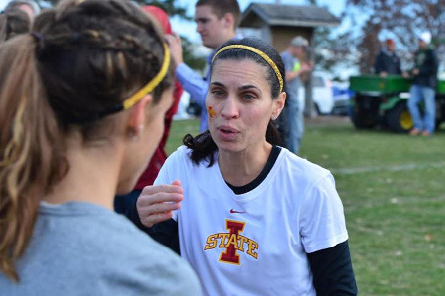 Womens cross country head coach Andrea Grove-McDonough talks to a runner at a meet. She is now a distance womens track coach.