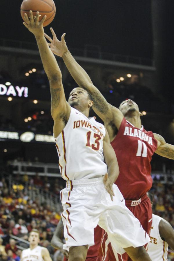 Senior guard Bryce Dejean-Jones goes to tip the ball into the basket during the CBE Hall of Fame semifinal against Alabama at the Sprint Center in Kansas City, Mo., on Nov. 24. The Cyclones defeated the Crimson Tide 84-74. Dejean-Jones had seven points and four rebounds for Iowa State.