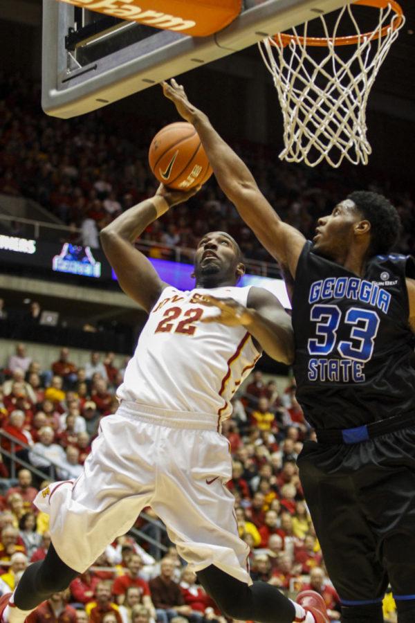 Senior forward Dustin Hogue attempts a shot on Georgia States Markus Crider during the game on Nov. 17 in Hilton Coliseum. The Cyclones defeated the Panthers 81-58. Hogue had 15 points for the Cyclones.