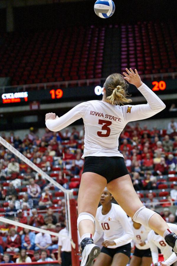 Redshirt sophomore outside hitter Morgan Kuhrt hangs in the air for a second before smashing the ball down towards the Kansas State defense on Nov. 5 at Hilton Coliseum. Iowa State defeated Kansas State in three close sets.