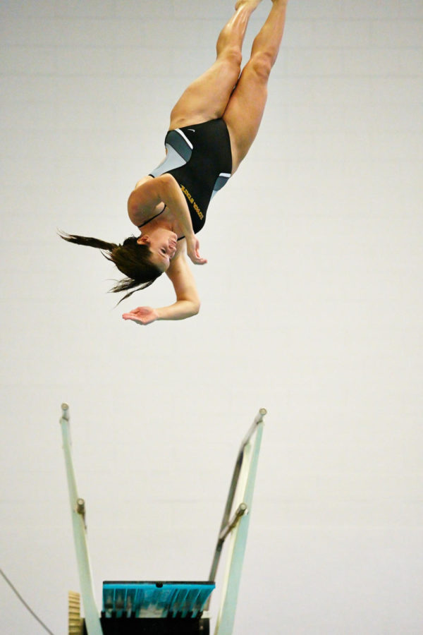 Freshman diver Sydney Ronald spins through the air in front of the judges. The meet involved competitors from Iowa State, University of Nebraska-Omaha and University of North Dakota and took place on Oct. 31.