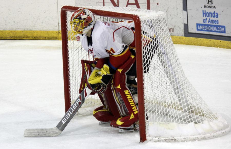 Senior Matt Cooper, goalie, guards the net during the hockey game against Lindenwood. Iowa State suffered a 3-2 defeat against Lindenwood on Oct. 17 at the ISU/Ames Ice Arena and another loss on Oct. 18 of 2-1 in overtime.