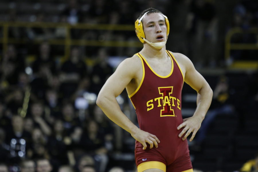 Redshirt junior Tanner Weatherman stands after allowing the final two-point lead to Mike Evans in the 174-pound match, losing 7-4 at the CyHawk duel in Iowa City on Nov. 29. The No. 15 Cyclones struggled to secure matches that were close, falling to rival No. 1 Iowa 28-8.
