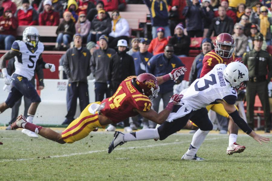 Senior linebacker Jared Brackens leaps onto West Virginia quarterback Skyler Howard on Nov. 29 at Jack Trice Stadium. The Cyclones fell to the Mountaineers 37-24. Brackens tallied two solo tackles in the game.