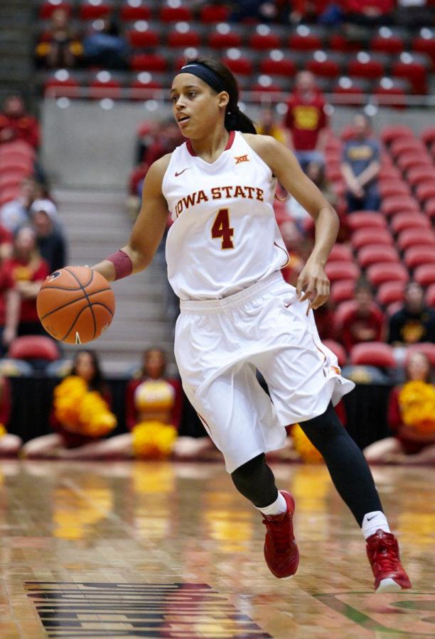 Senior guard Nikki Moody dribbles down the center of the court. Iowa State won the game against USC Upstate 98-76 and managed to stay up by more than 20 points for nearly the entire game which took place Nov. 16.
