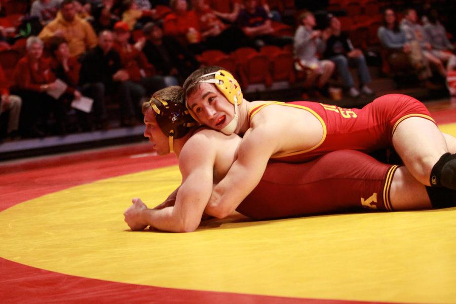 ISU sophomore Tanner Weatherman takes down his opponent while wrestling in the 174 weight class. Weatherman fell by decision with a final score of 10-6. Minnesota was victorious over ISU with a final score of 27-12. 