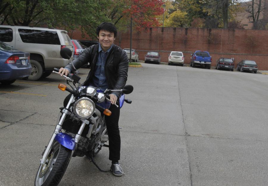 Marcus Naik, senior in mechanical engineering and an international student from Malaysia, drives his motorcycle on campus. International students have to take more steps before getting their U.S. drivers license.