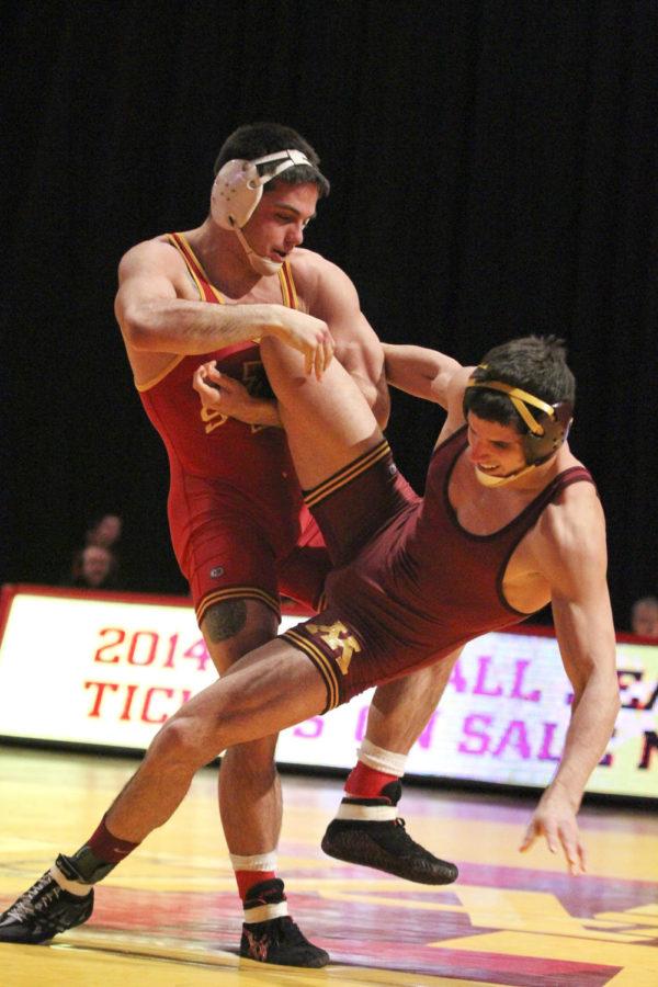 165-pound+Michael+Moreno+throws+his+opponent%2C%C2%A0Danny+Zilverberg%2C+during+the+dual+against+Minnesota+on+Feb.+23+at+Hilton+Coliseum.+The+Cyclones+fell+to+the+Golden+Gophers+12-27.+Moreno+took+his+match+in+a+7-3+decision.