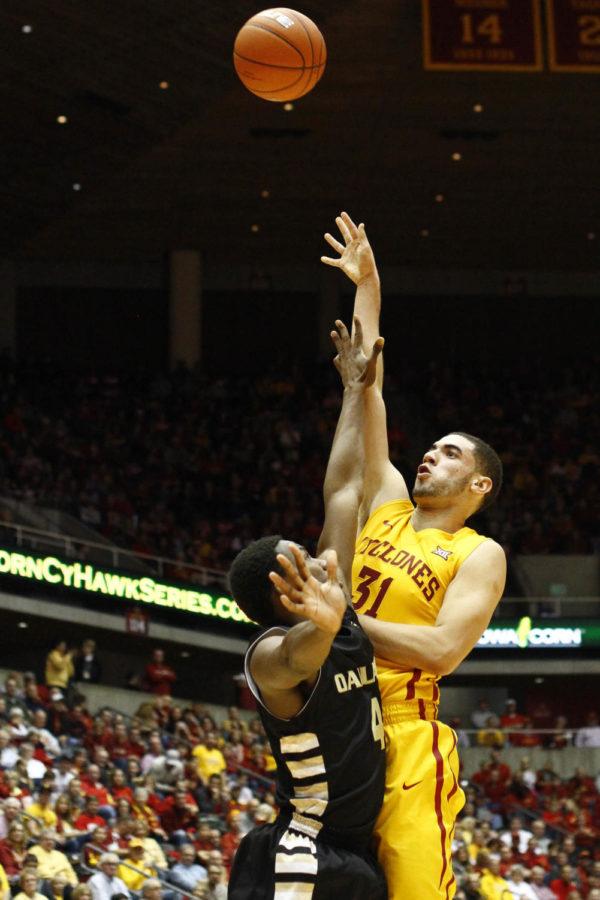 Junior forward Georges Niang shoots from behind the arc against Oakland on Nov. 14 at Hilton Coliseum. The Cyclones beat the Golden Grizzles 93-82. Niang had 30 points and became the 31st Cyclone to reach 1,000 career points.