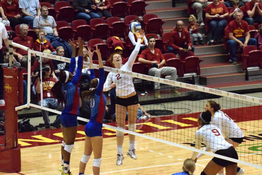 Junior right side hitter Mackenzie Bigbee goes for a kill against Kansas on Oct. 22. Bigbee finished with 10 total kills on the night. 