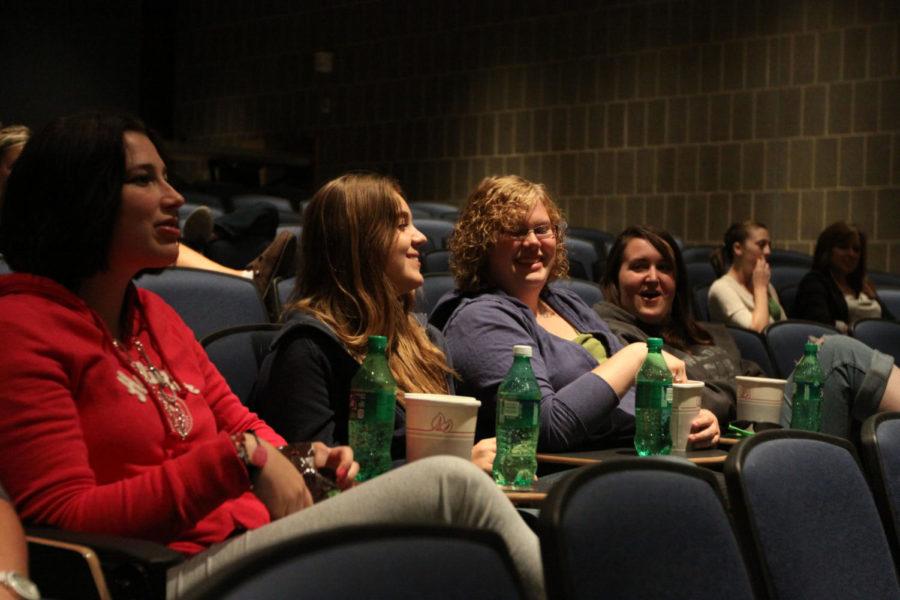 Destiny Taylor, freshman in animal science, left, Richelle
Fermanich, freshman in pre-business, Tessa Flak, open-option
freshman, and Megan Eisenmann, freshman in psychology, watch free
movies Thursday at Carver Hall. Cyclone Cinema provides free movies
every week, which attract many students interests.

