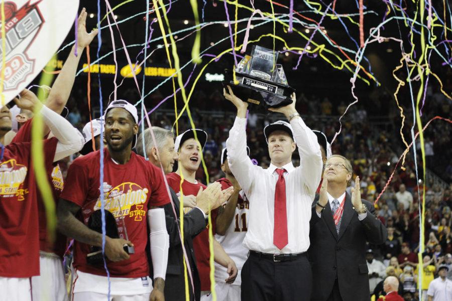 ISU coach Fred Hoiberg holds up the Big 12 Championship trophy after the Cyclones defeated Baylor 74-65 in the final round in Kansas City, Mo. This is Iowa States first conference championship title since 2000.