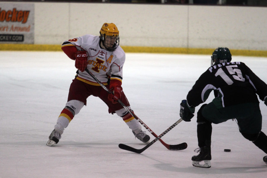 Senior defensive player Antti Helanto reaches for the puck while it is in Ohios possession. Iowa State suffered a 4-2 loss to the Bobcats on Nov. 1.