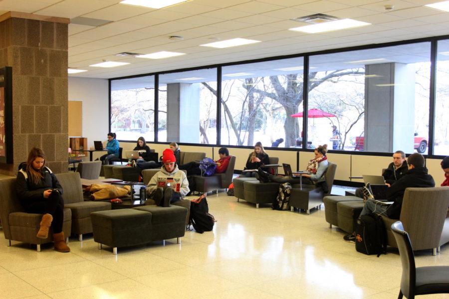 Students using various forms of technology while waiting for their next class in the Carver lounge on Dec. 2nd.