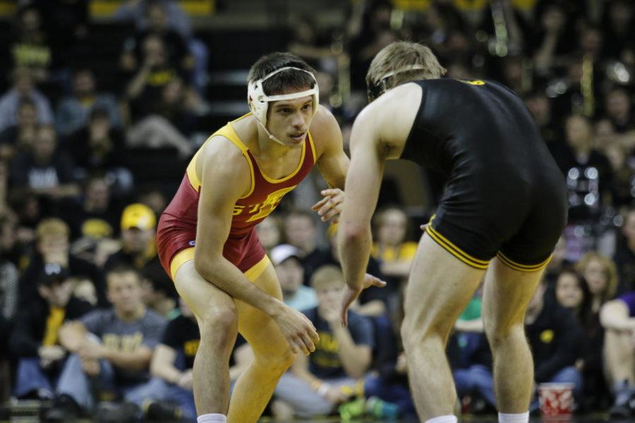 Redshirt+sophomore+Gabe+Moreno+earns+a+takedown+against+Iowa%E2%80%99s+Brandon+Sorensen.+Moreno+gave+up+an+escape+late+in+the+third+period%2C+losing+the+close+149-pound+match+7-6+in+the+Cy-Hawk+Series+duel+took+place+on+Nov.+29+in+Iowa+City.+The+No.+15+Cyclones+struggled+to+secure+close+matches%2C+falling+to+rival+No.+1+Iowa+28-8.
