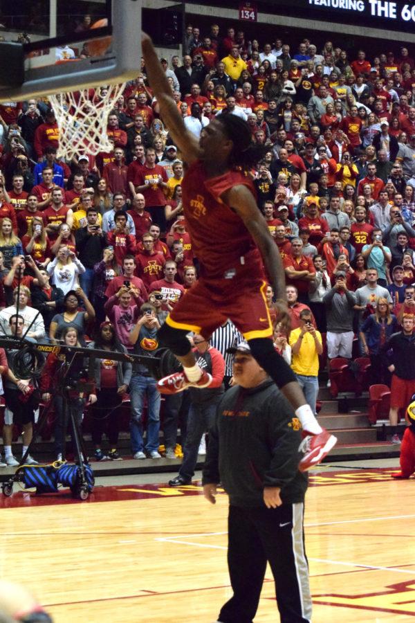 Redshirt junior Jameel McKay dunks over a team manager during the dunk contest at Hilton Madness on Oct. 18.