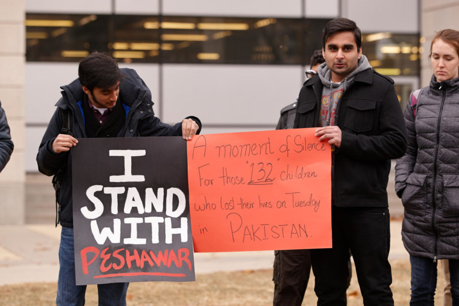 Students outside Parks Library hold a moment of silence Thursday, Dec. 18, for the lives lost as a result of a terrorist attack on a Pakistani school on Tuesday, Dec. 16, where more than 100 innocent children and school staff were killed by the Pakistani Taliban. 
