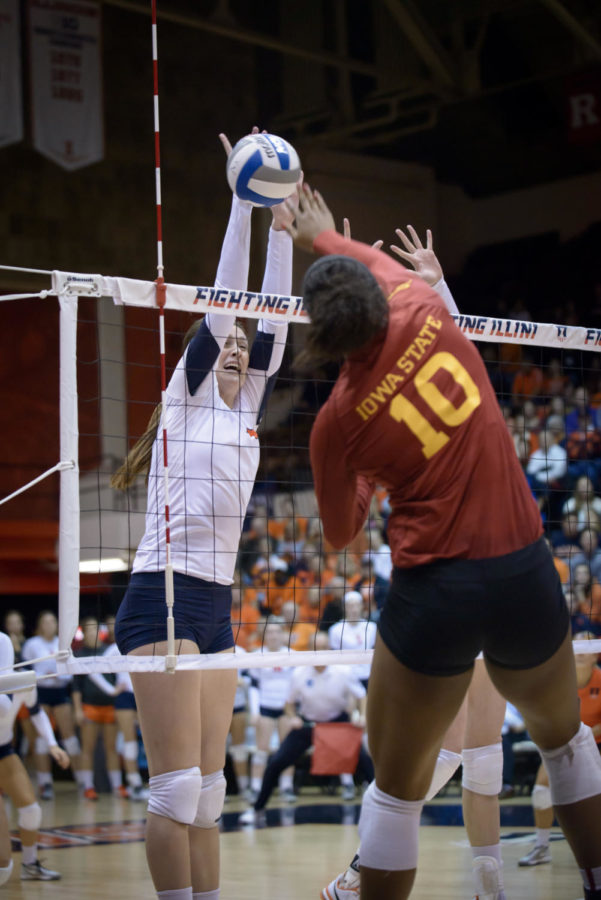 Senior outside hitter Victoria Hurtt is blocked by an Illinois player during the second round of the NCAA tournament in Champaign, Ill., on Dec. 6. The Cyclones fell to the Fighting Illini 3-0. 