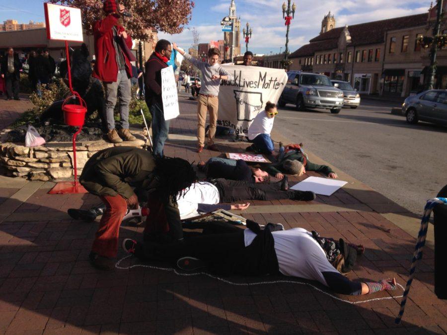 People in Kansas City, Mo., draw chalk lines around their bodies Nov. 28 in protest to the grand jury decision to not indict Officer Darren Wilson, who shot 18-year-old Michael Brown in August. 