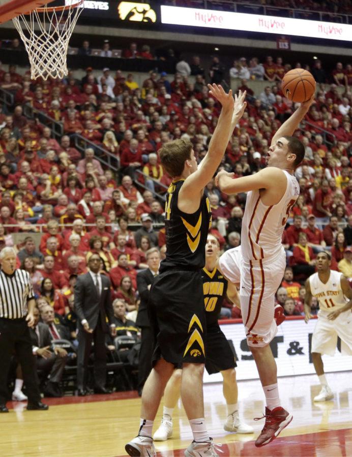 Sophomore forward Georges Niang shoots over an Iowa defender during Iowa States 85-82 win over the Hawkeyes Dec. 13 at Hilton Coliseum. Niang led the Cyclones in scoring with 24 points.