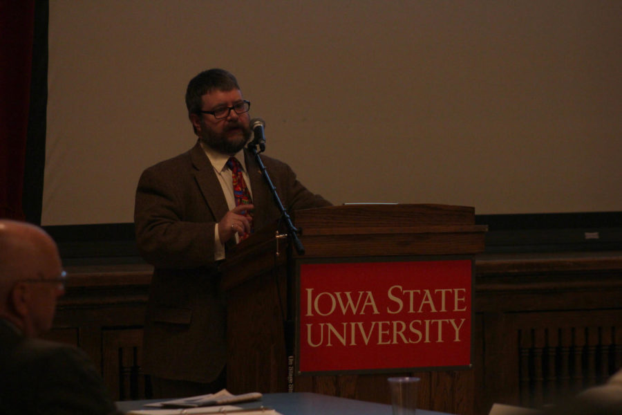 Steve Freeman from the department of agricultural and biosystems engineering talks about the changes in faculty review policies at the Faculty Senate meeting Dec. 9 in the Great Hall of the Memorial Union.