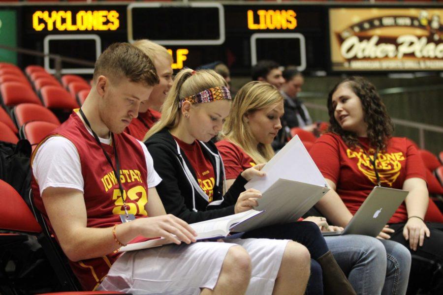 Students before the game study for their final exams. After studying they watched Iowa State defeat Arkansas Pine-Bluff 82-56 Dec. 14.
