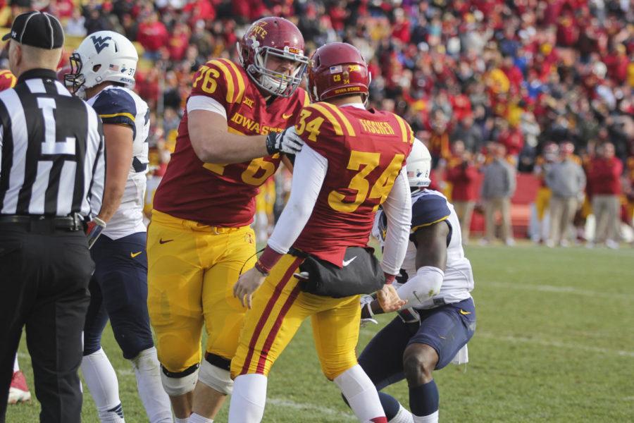 Redshirt+junior+holder+Austin+Fischer+and+redshirt+junior+lineman+Jamison+Lalk+celebrate+after+Fischer+successfully+faked+a+field-goal+attempt+on+a+fourth+down+to+give+the+Cyclones+a+first+down+against+West+Virginia+on+Nov.+29+at+Jack+Trice+Stadium.+The+Cyclones+fell+to+the+Mountaineers+37-24.