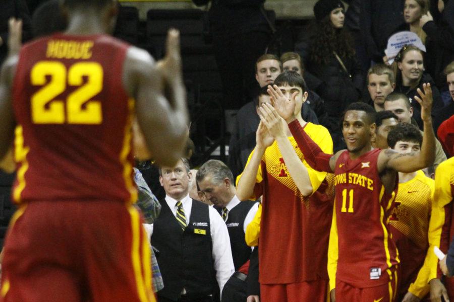 Sophomore guard Monte Morris celebrates a bucket by Dustin Hogue against Iowa on Dec. 12 at Carver-Hawkeye Arena. The Cyclones beat the Hawkeyes 90-75.