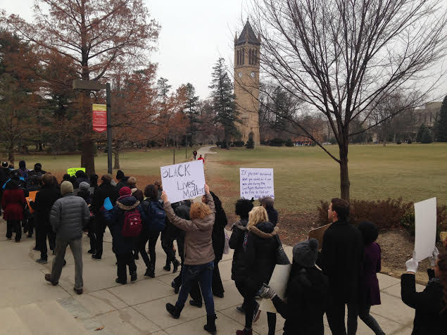 Demonstrators from the Ames and Iowa State community march across campus in a silent demonstration to raise awareness on what they believe is modern day racism happening across the nation. 