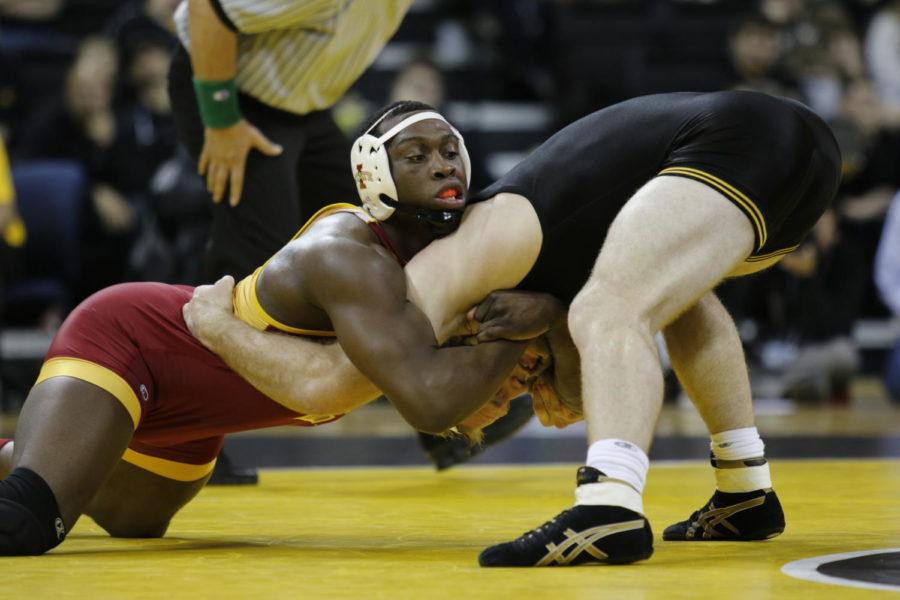 Redshirt senior Kyven Gadson forces down Iowa’s Kris Klapprodt for a takedown. Gadson secured a pin in the 197-pound match, earning the Cyclones another victory at the Cy-Hawk Series took place on Nov. 29 in Iowa City. The No. 15 Cyclones struggled to secure matches that were close, falling to rival No. 1 Iowa 28-8.