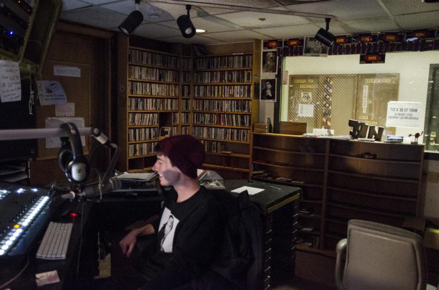 Tanner Vieth (DeeJay Tanner), a junior in psychology, DJs during the DM Tea radio show on KURE 88.5 FM.