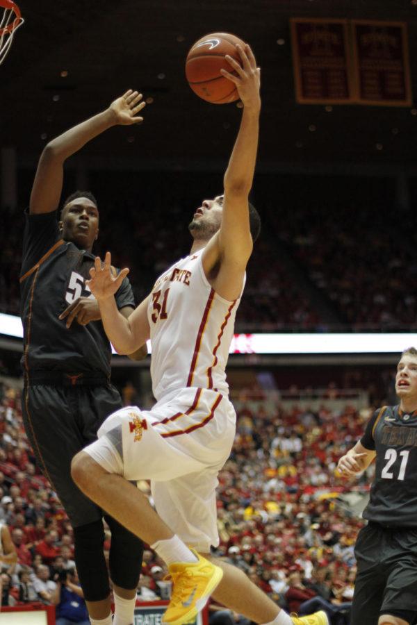 Junior forward Georges Niang jumps for a layup during Iowa States matchup with Texas on Jan. 26. Niang scored 19 points with three assists, aiding in a 89-86 victory against the Longhorns.