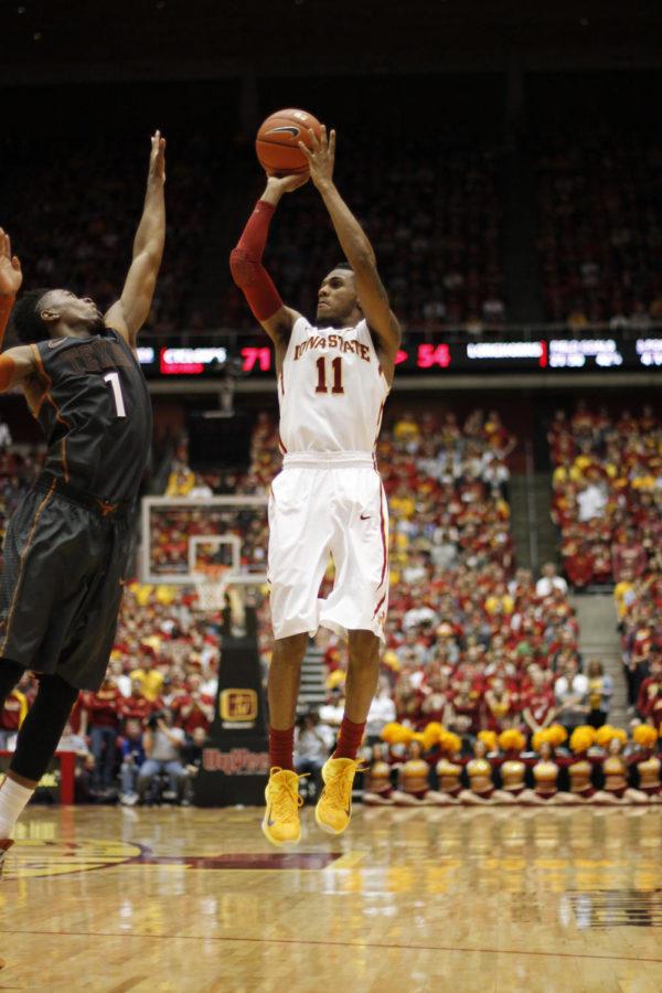 Sophomore guard Monté Morris shoots from outside the 3-point line during Iowa States matchup with Texas on Jan. 26. Morris scored 13 points with six assists, helping the Cyclones to an 89-86 victory against the Longhorns.