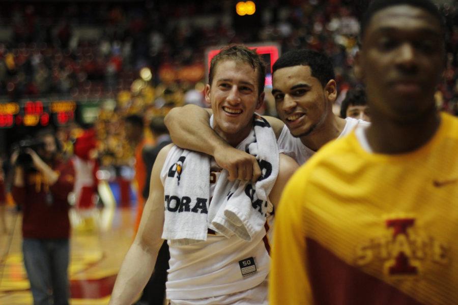 Junior guard Naz Long and sophomore guard Matt Thomas celebrate after winning their first game in the Big 12 tournament.